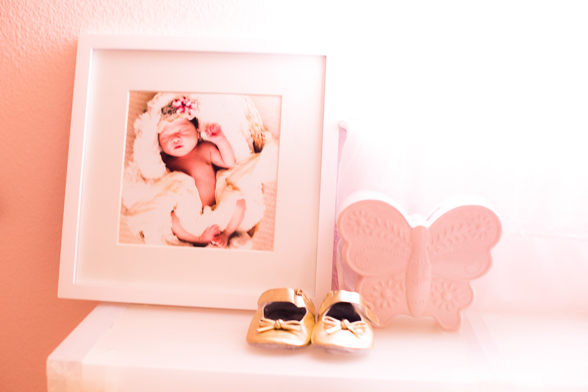 toddler girl pink nursery, shelf decor, framed print, gold baby shoes, butterfly piggy bank