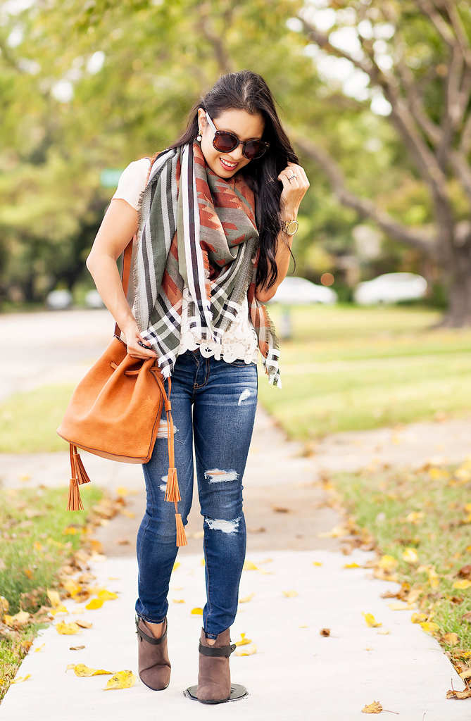 cute & little | petite fashion blog | southwestern oversized scarf, tassel bucket bag, distressed jeans, lace top | fall outfit