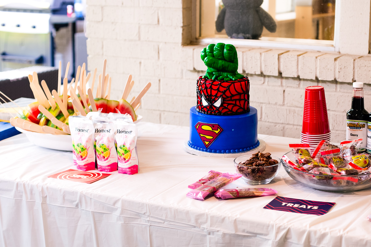 toddler superhero birthday party table setup food decorations